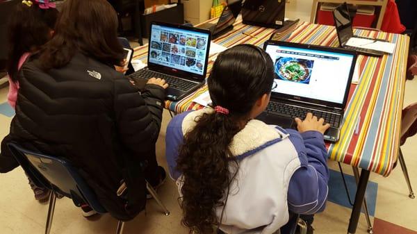 Parents learning how to use PowerPoint