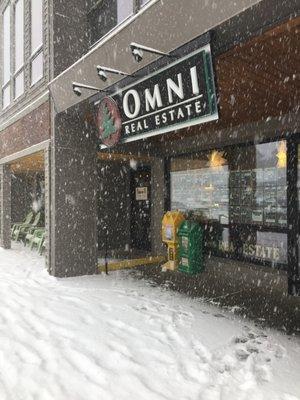 Snowing in Frisco, CO at Omni Real Estate on Main Street.