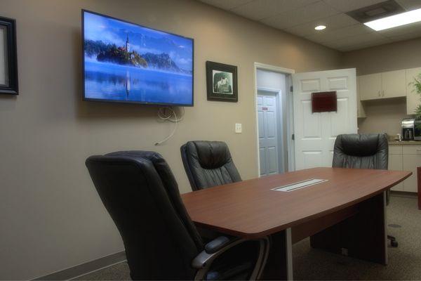 Conference room with large monitor, where you will talk to your CPA.