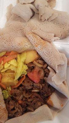 Awaze Tibs with local injera & cabbage and potatoes