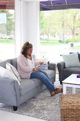 Lounge with a book nook full of books about making.