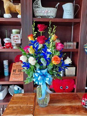 This is a colorful roses floral arrangement with orchids our customer asked for this Father's Day 2021.