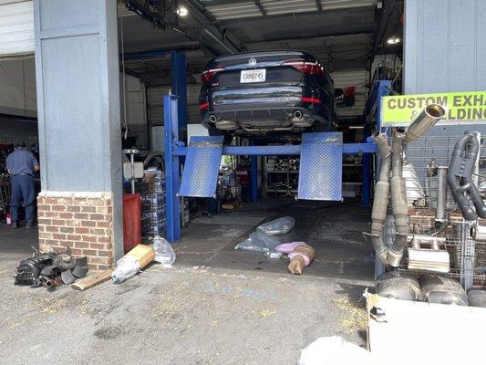 Old exhaust being taken off.