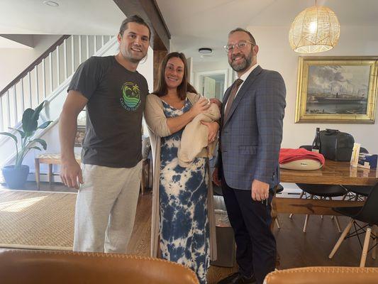 Rabbi Asher with parents and baby boy