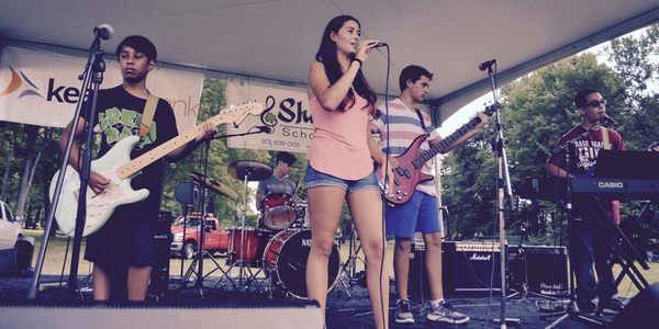 Our rock band program features weekly rehearsals and performances at major events like the Pequannock Hoedown.