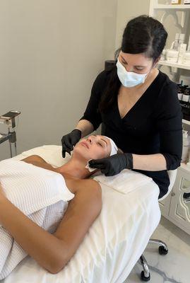 Shannon applying the cult-favorite Biologique Recherche P50 Lotion during a facial!