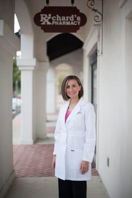 The pharmacist Vanessa outside the store on opening day.