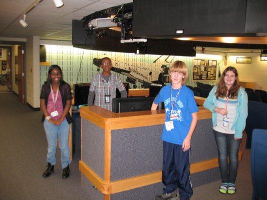 Middle school students at the planetarium control console