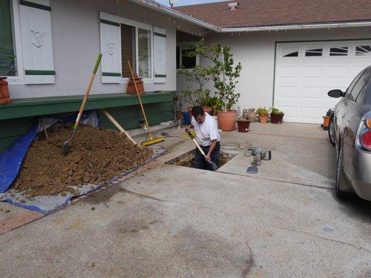 Jaime preparing a hole for a trenchless sewer replacement