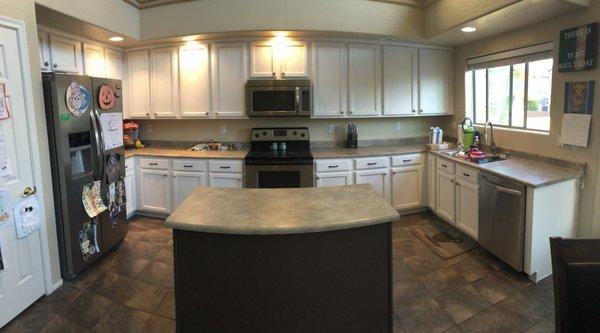 We painted cabinets white, using Benjamin Moores Lacquer finishes. The island got painted an Espresso color as an accent color.