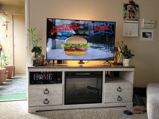 TV stand with fireplace and 50" Samsung Crystal Smart TV.