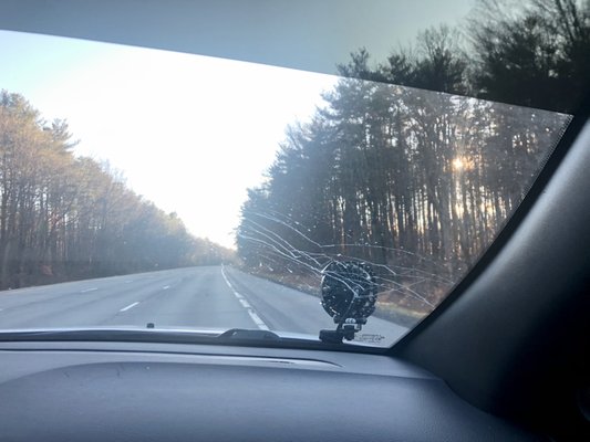 Dirty windshield after car wash due to poor drying process.