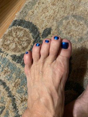 Vincent painted my toes shiny blue.