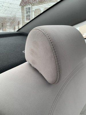 Hand prints on the rear headrest.