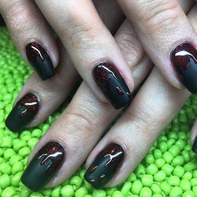 Matte black with glitter blood drip for Halloween. Gel polish on natural nails