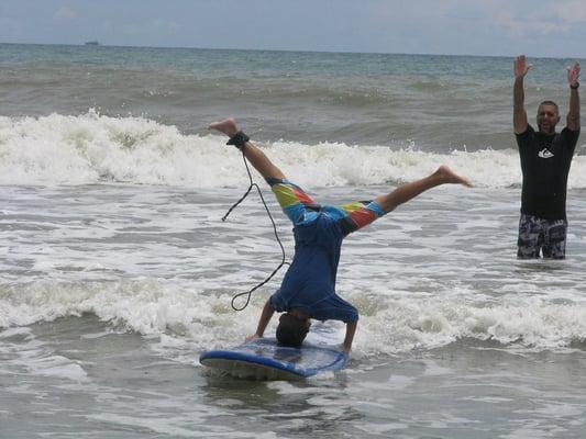 First surf lesson and already doing headstands!