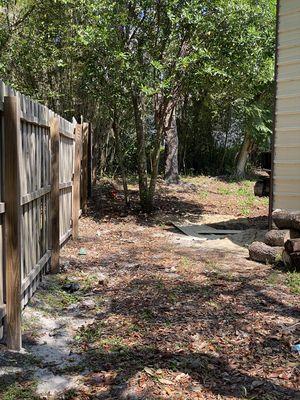 Some before and after photos of a privacy fence we replaced/installed. This is before.