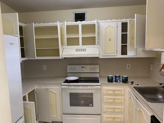 Customer wanted to Change cabinet colors from eggshell to white and freshen up walls.