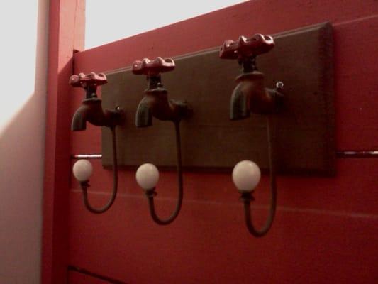 Creative purse hanger in bathroom.