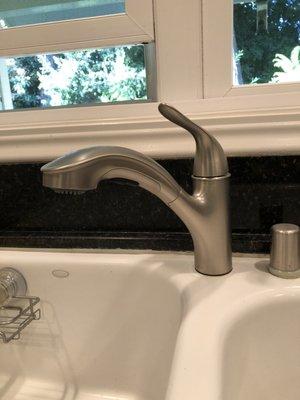 Newly installed customer supplied kitchen sink faucet.