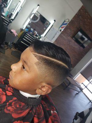 Kids mid skin fade with hard part