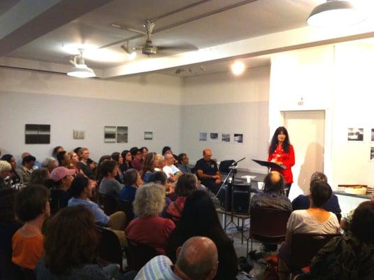 Native American author Joy Harjo reads to a packed gallery at  Woodland Pattern, 2012