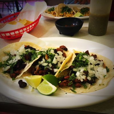 Pork tacos (pastor) on corn tortillas