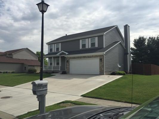 A house after Buckeye Vinyl replaced siding, windows, and shutters.