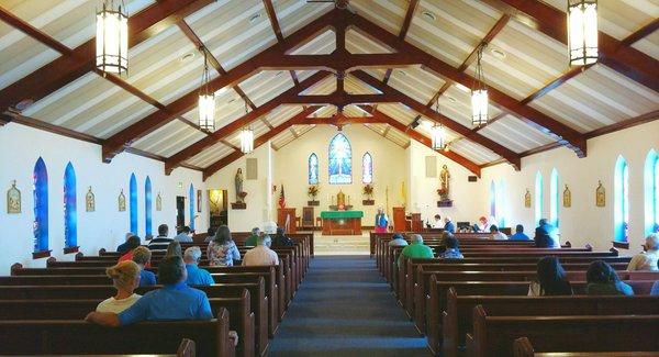 Facing the altar and tabernacle.