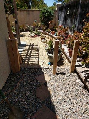 Building a short little fence to keep the pups inside the back yard.