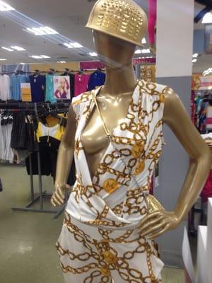 Gold chain print jumpsuit .. Get the hat as well to complete the look.