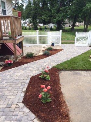 Walkway, fence, mulching, sod and flowers all done by Mancini Landscape Design!