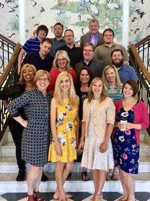 Dr. Heidi Blossom with a team of communications professionals.