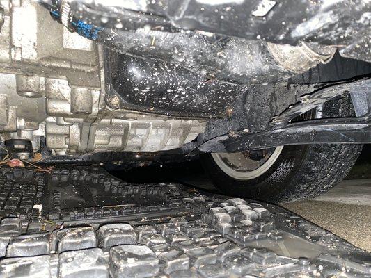 Close up view of splash shield that was improperly re-installed by Argyle Valvoline employees. (Came off while my wife was driving the car)