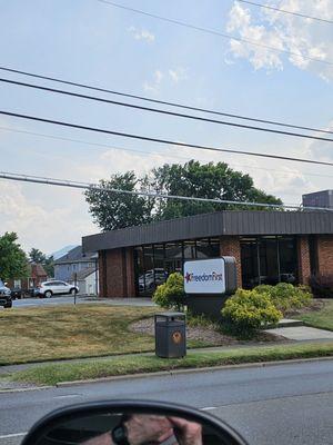 A view of the Freedom First Credit Union Vinton branch from the car.