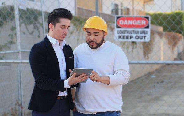 Enoch Garcia with a Construction Client