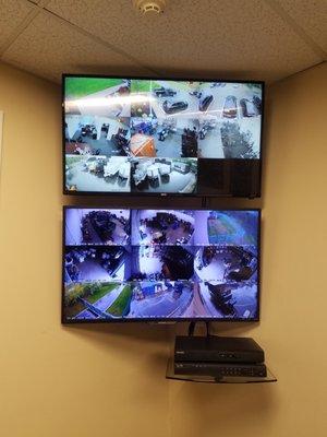 Security monitors (system installed by others) mounted on wall and wiring cleaned up