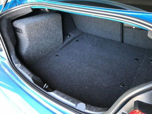 Custom enclosure for JL 10" subwoofer. The trunk is still usable!