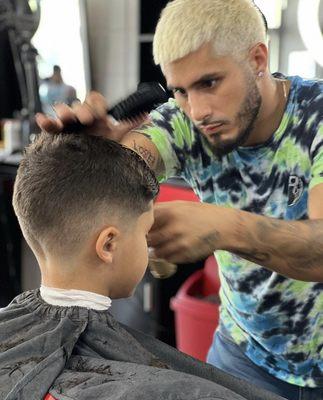 One of are spectacular barbers working behind the scenes