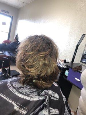 Layered and blow dry and styled. By Silvia. Call to make an appointment today. Thank you!