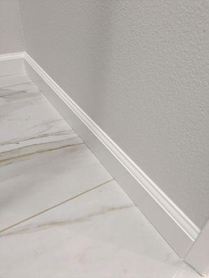 Floor and baseboard installation and paint