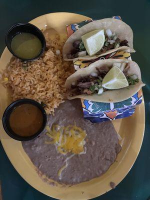 Carnitas taco, carne asada taco, rice and beans.