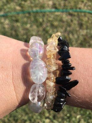 An aura quartz bracelet purchased from the store.