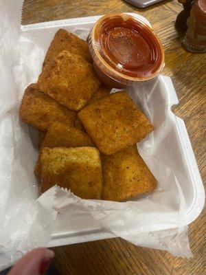 Cold fried raviolis with cold marinara sauce they're not even squishy like they're supposed to be they're hard as rocks