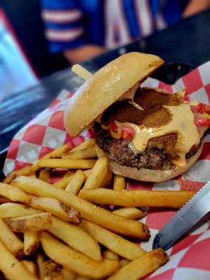 Spicy burger with ghost pepper powder and fries