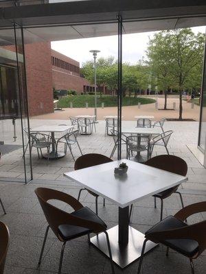 A glass partition separates the outside dining area from the inside dining area.  So beautiful!