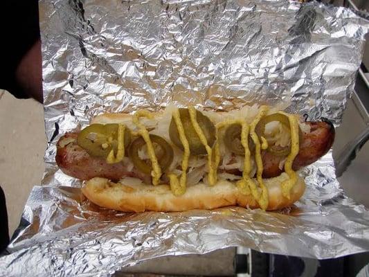 A true Diamond Dawg's beer-battered Dawg fresh off the grill with peppers and mustard