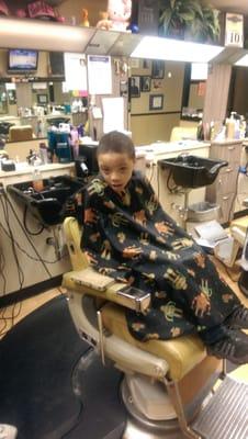 My son getting ready for his hair cut.