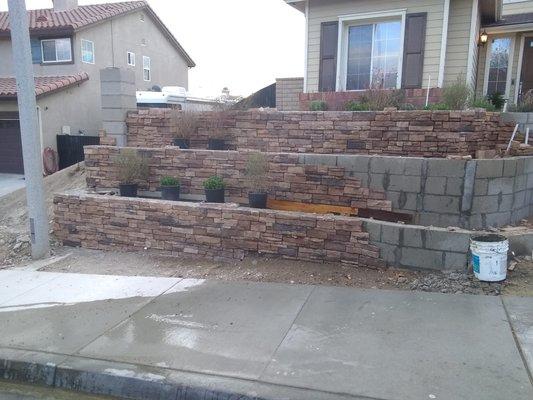 Retaining wall and stacking stones installation.