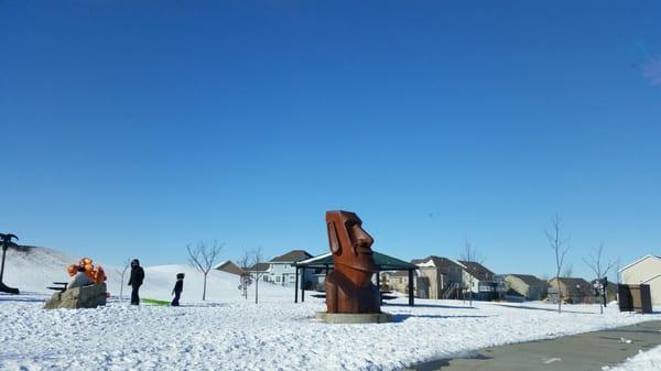 Maui, easter island head in Altoona, Iowa